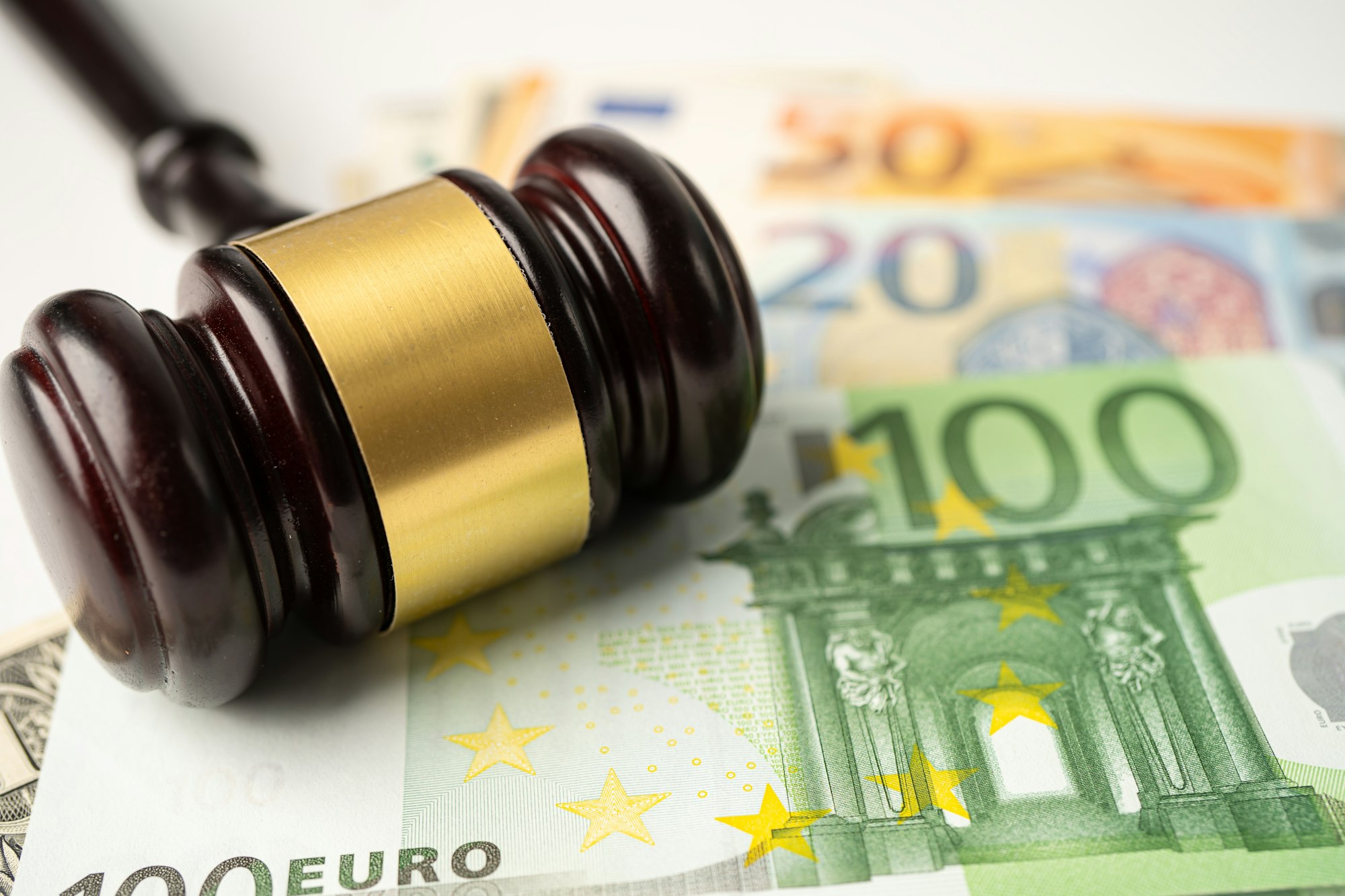 Gavel for judge lawyer on Euro banknotes background.